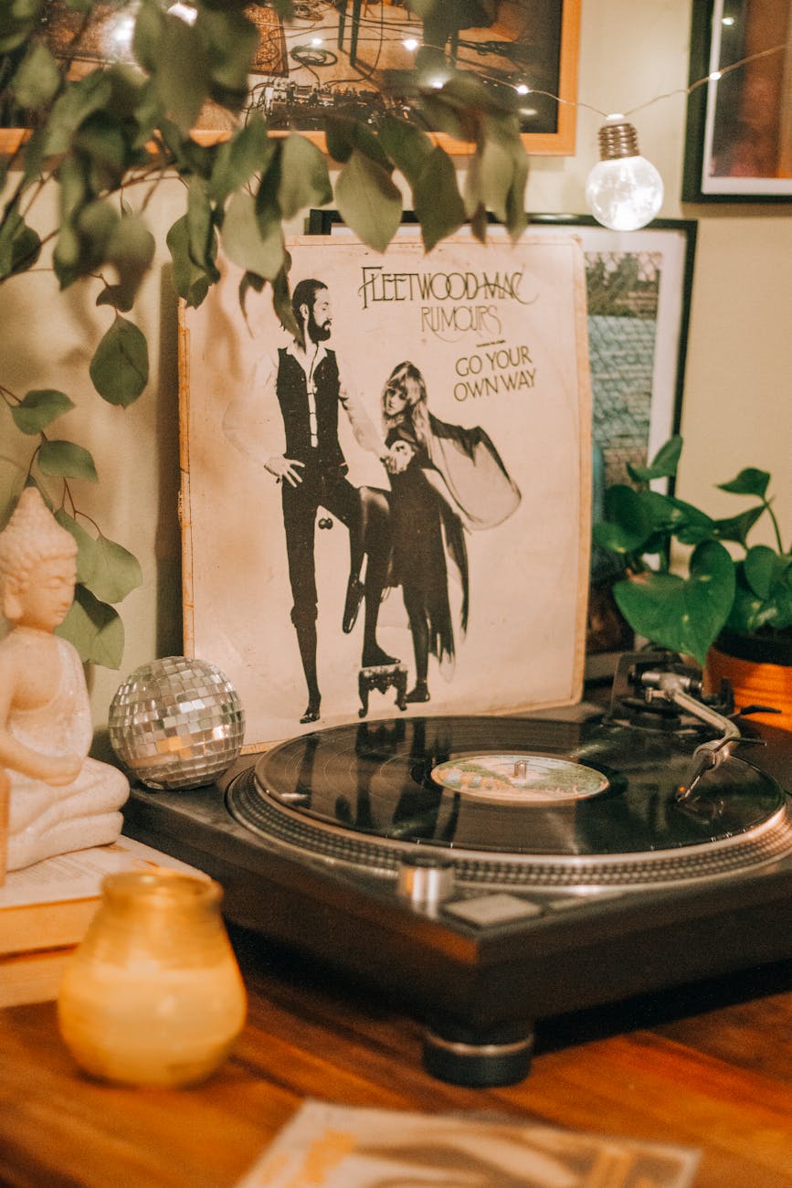 Cozy scene featuring a vintage vinyl turntable, Fleetwood Mac album, and eclectic decorations.